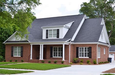 charcoal gray metal roof on red brick house|black roof for red brick house.